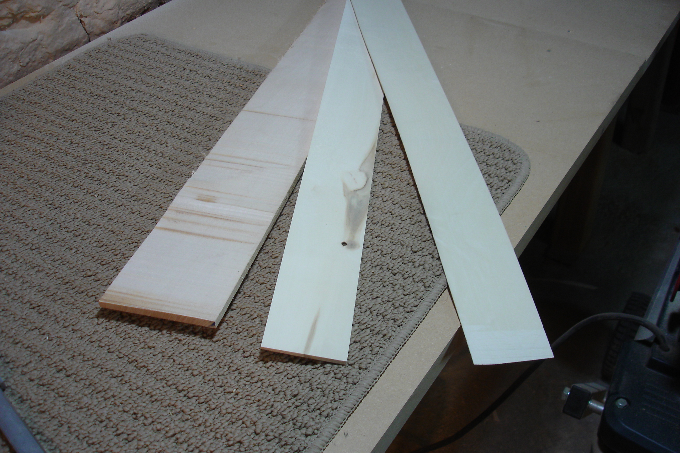 Veneer from start to finish: a solid piece of wood from the supplier (bottom sheet), a resawed unthicknessed piece with one smooth side from the jointer (middle) and a thicknessed veneer (top).